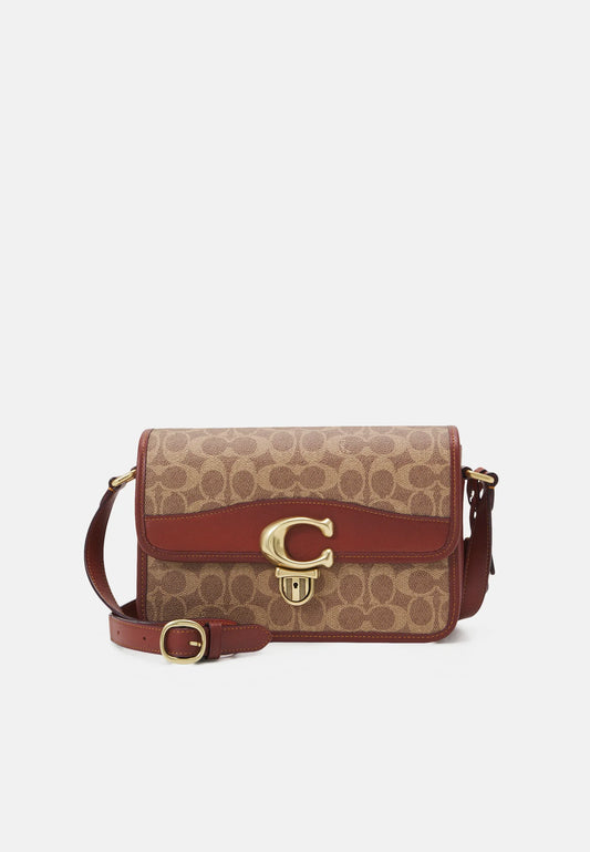 Coach
Sac besace Tabby